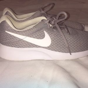 Grey Nike running shoes